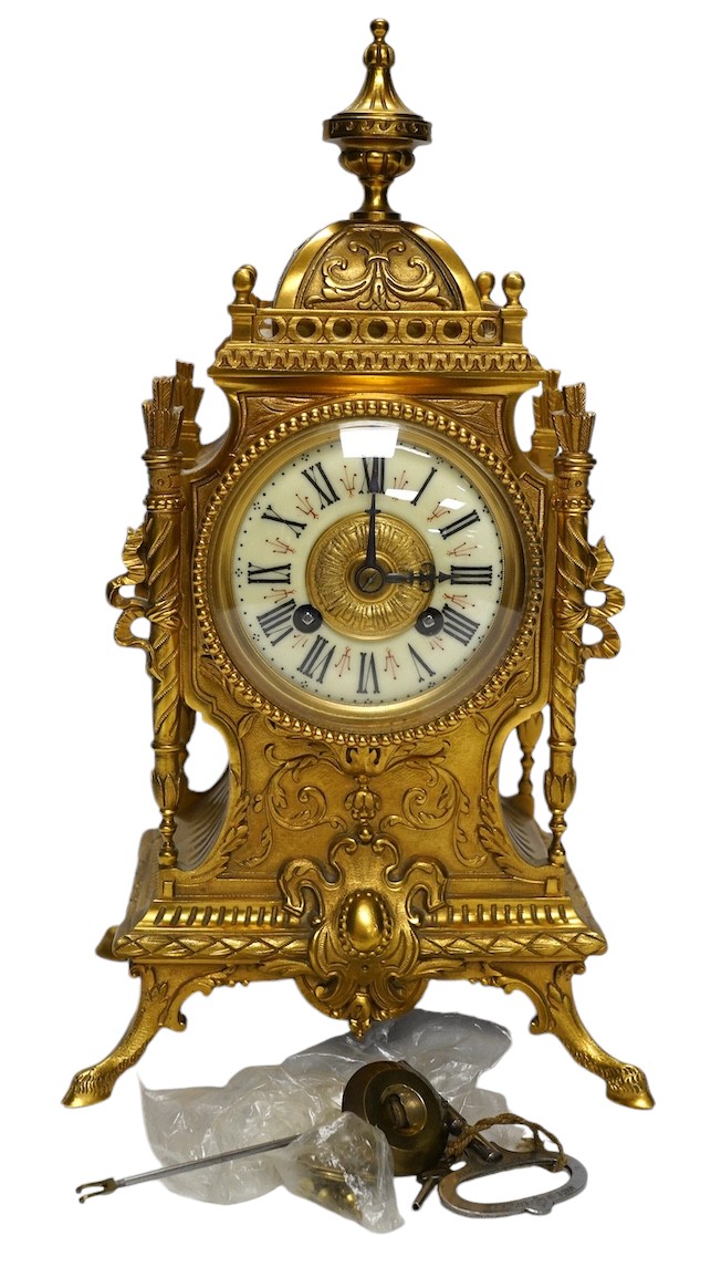 An early 20th century French ormolu mantel clock with key and pendulum, 33cm. Condition - good, not tested as working